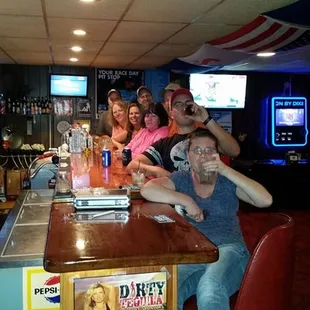  group of people sitting at a bar