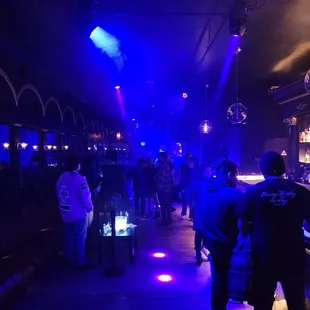 10 people on Saturday night at 1 am, and they won't let you go upstairs after paying for a show. Shitty service too. Don't waste your time.