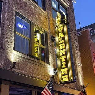 the neon sign for a restaurant