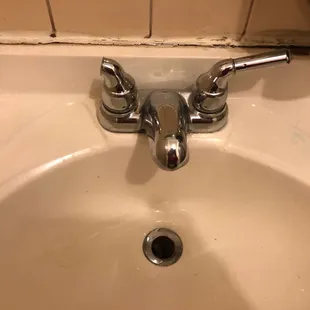 a sink with two faucets