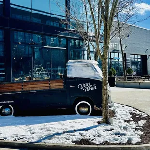 a van parked in front of a building