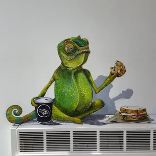 a lizard eating a sandwich