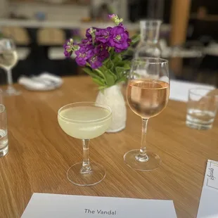 two glasses of wine and a menu