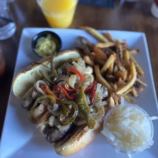 Beer Brauts  with spicy mustard and sauerkraut. Hand-Cut French Fries