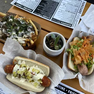 Clockwise: roasted garlic poutine, Thai breaker, Nashville hot chicken