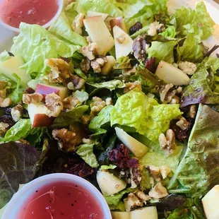a plate of salad with dressing