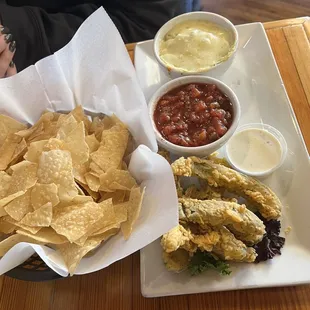 Sample appetizer platter. Chips and salsa, spinach artichoke dip and fried pickles.