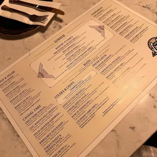 a menu on a marble table