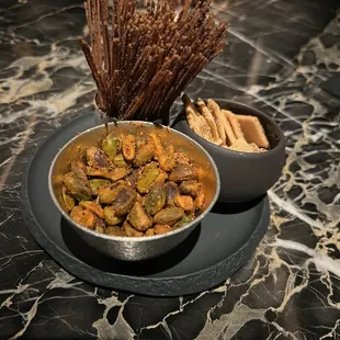 Munch items included - truffle spaghetti, cheese crisps, and seasoned pistachios. A good balance of texture and flavors on all of these.