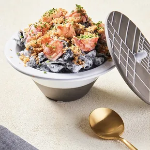 a bowl of food and a spoon