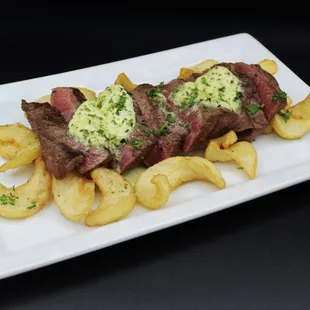 Steak Frites

8 oz Choice Petite Tender  |  Char-grilled &amp; Sliced  |  Truffle Parm Fries  |  Herb Butter