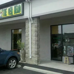 a car parked in front of a restaurant
