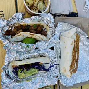 Birdie Sanders, Al Pastor, Brunch burrito, and Jalapeno Mac N&apos; Cheese and Choice of Nom Taco