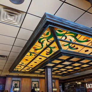 a ceiling with a stained glass window
