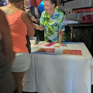 a woman signing a book