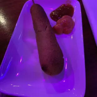 Corn dog with pimiento cheese and aardvark sauce