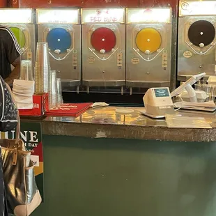 a woman standing in front of a counter