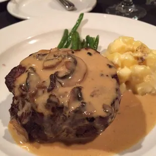 Steak Diane topped with mushroom Dijon cream sauce.