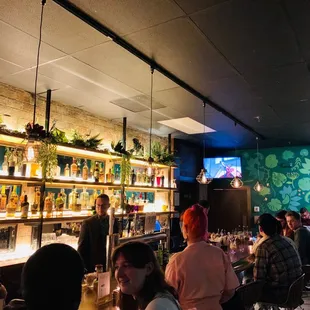 Picture of the bar... it's mostly standing room w a bar w purse hooks along the wall and some bar stools at the bar pictured here.