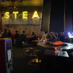 a group of people sitting at a restaurant