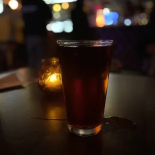 a glass of beer on a table