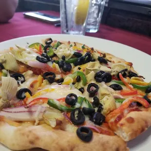 The "kalamata olives" on the pizza....