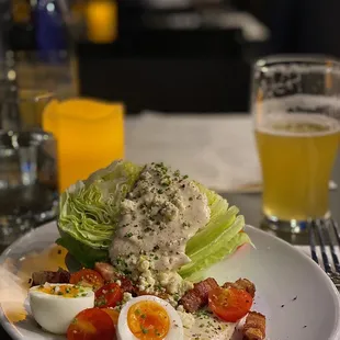 The Wedge Salad - AMAZING. Perfect balance of flavors. The chunky bacon, and boiled egg were cooked to perfection.