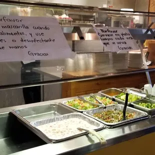 a buffet with a variety of food items