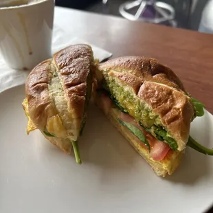 Egg Sandwich with tomato, pesto, spinach and cheese.