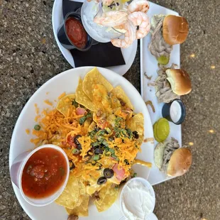 Shrimp cocktail, nachos, and sliders
