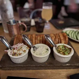 Spread - Pressed Italian Bread with Spicy Feta, Pimento Cheese, and Brie, Date, Spicy Apricot with cucumber slices