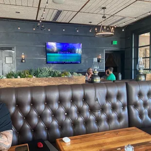 a man sitting at a table in a restaurant