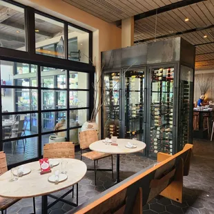 a dining area with tables and chairs