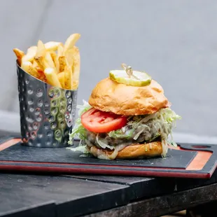 a hamburger and french fries on a tray