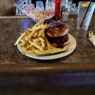 Backyard BBQ burger upgraded with fries.