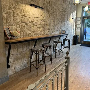 Indoor seating. There's more indoor seating with tables next to the window.