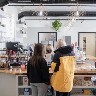 a group of people standing around a counter