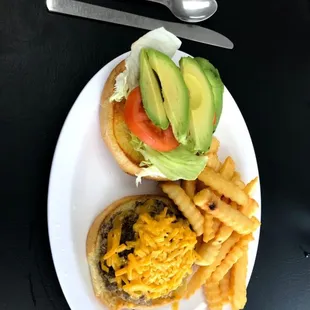 Cheeseburger with added avocado and french fries