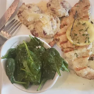 a plate of chicken and spinach