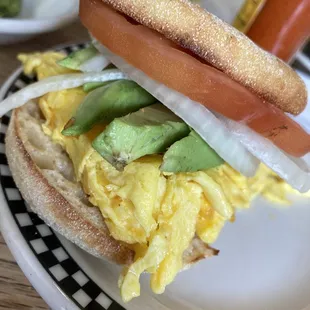 Menu hack: turned sides into a breakfast sandwich! (Scrambled eggs with cheddar, English muffin, avocado, tomato, onion)