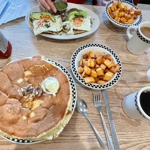 Pancake with walnuts, home fries, huevos rancheros