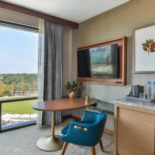 Sitting area with large window overlooking The Village neighborhood