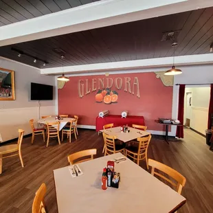 a dining area with tables and chairs