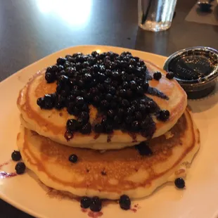 a stack of pancakes with blueberries