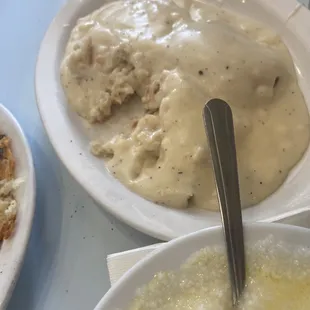 a bowl of gravy and a bowl of rice