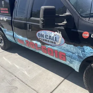 a black truck with blue graphics