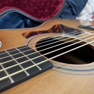 Guitar sound hole with strings