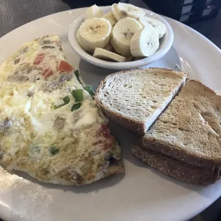 Garden omelette made with egg whites with a side of sliced bananas instead of the potatoes