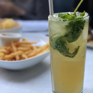 a glass of lemonade and a plate of french fries