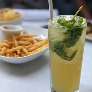 a glass of lemonade and french fries